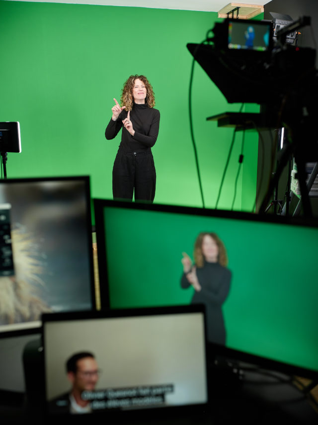 Photo de reportage sur fond vert pour la traduction en langue des signes à Lausanne
